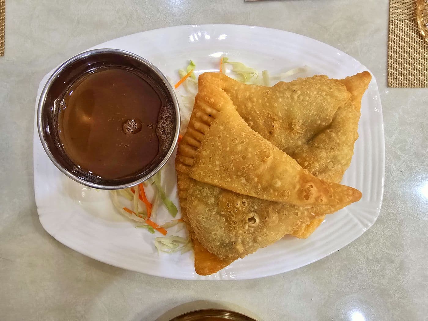Samosa served with tamarind dipping sauce at Little Asia